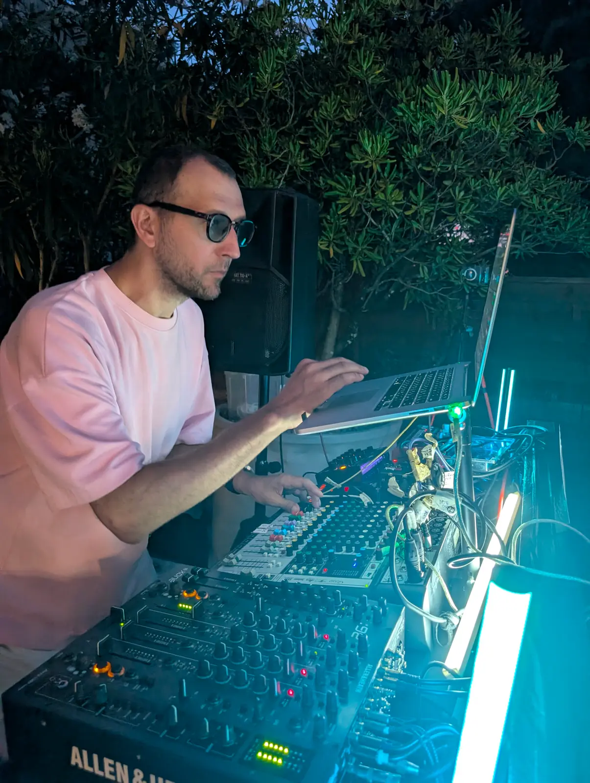 Live electronic set with laptop and Allen & Heath mixer on the terrace